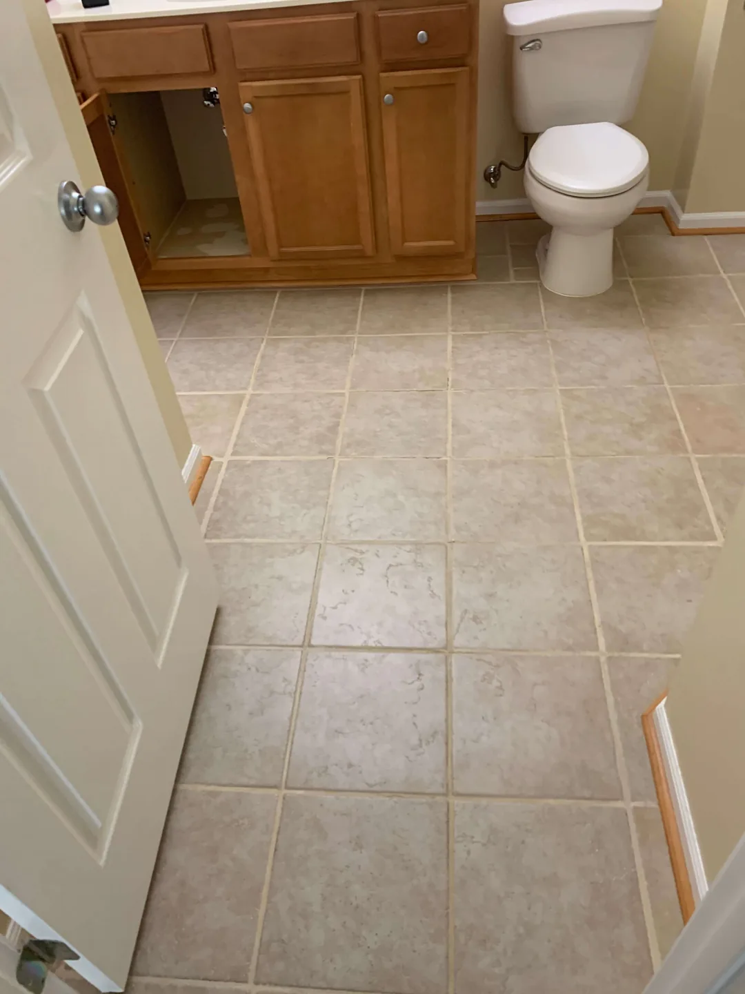 Bathroom floor and vanity before renovation