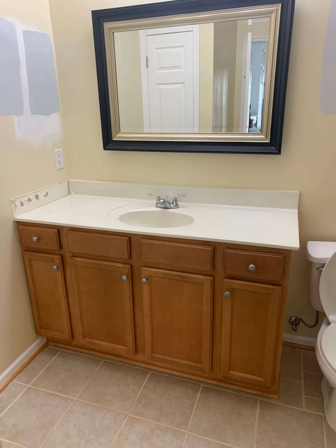 Bathroom vanity and floor before renovation