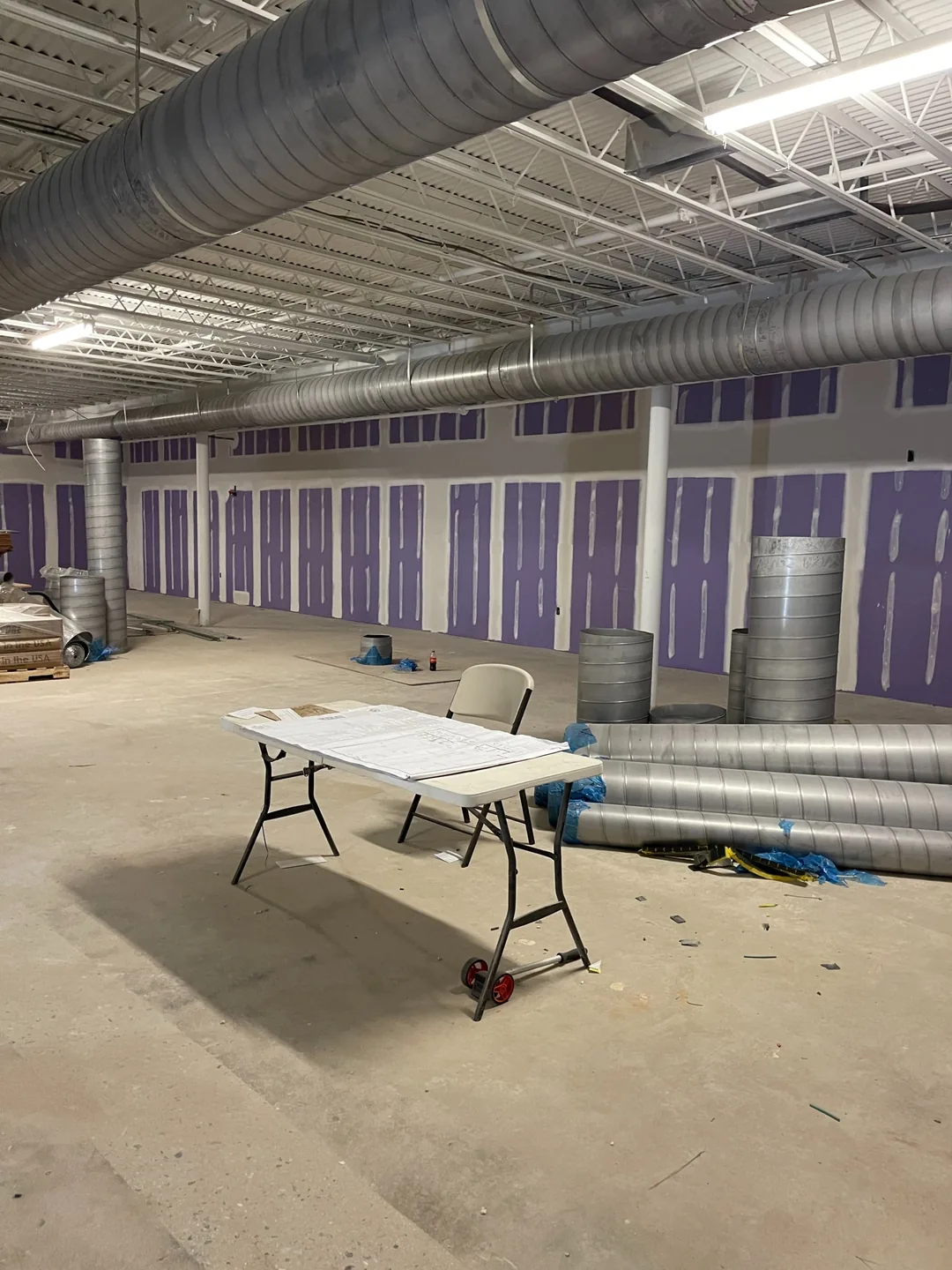 Large commercial open space during drywall and ceiling coordination