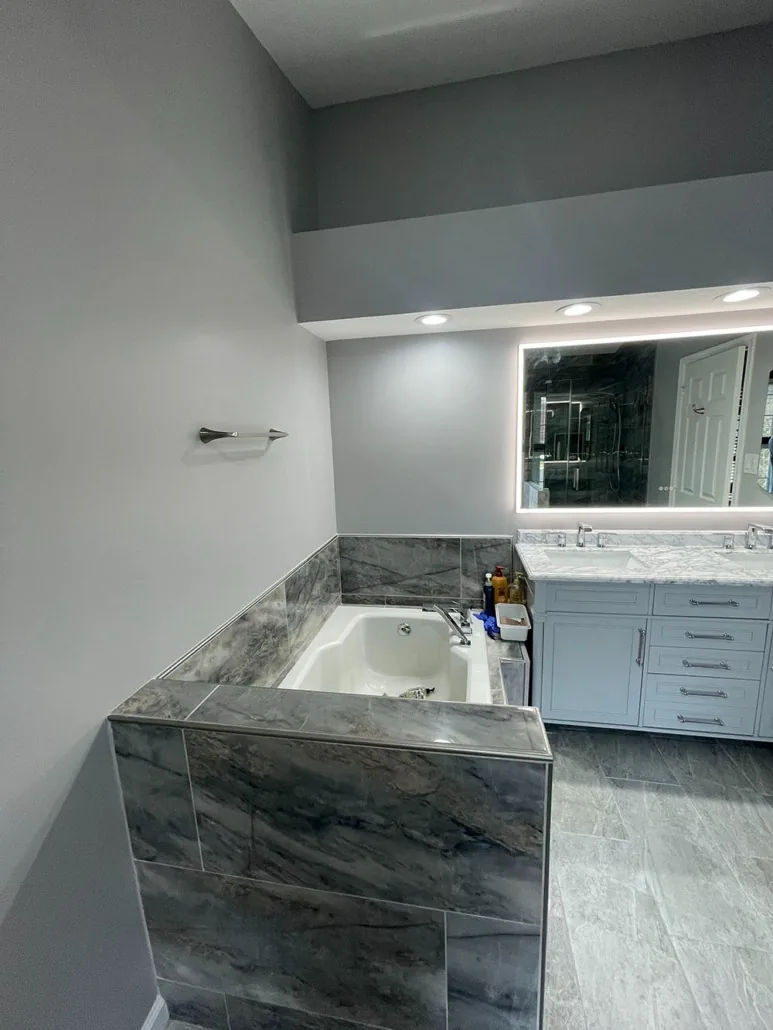 Compact completed kitchen with gray cabinetry and updated surfaces