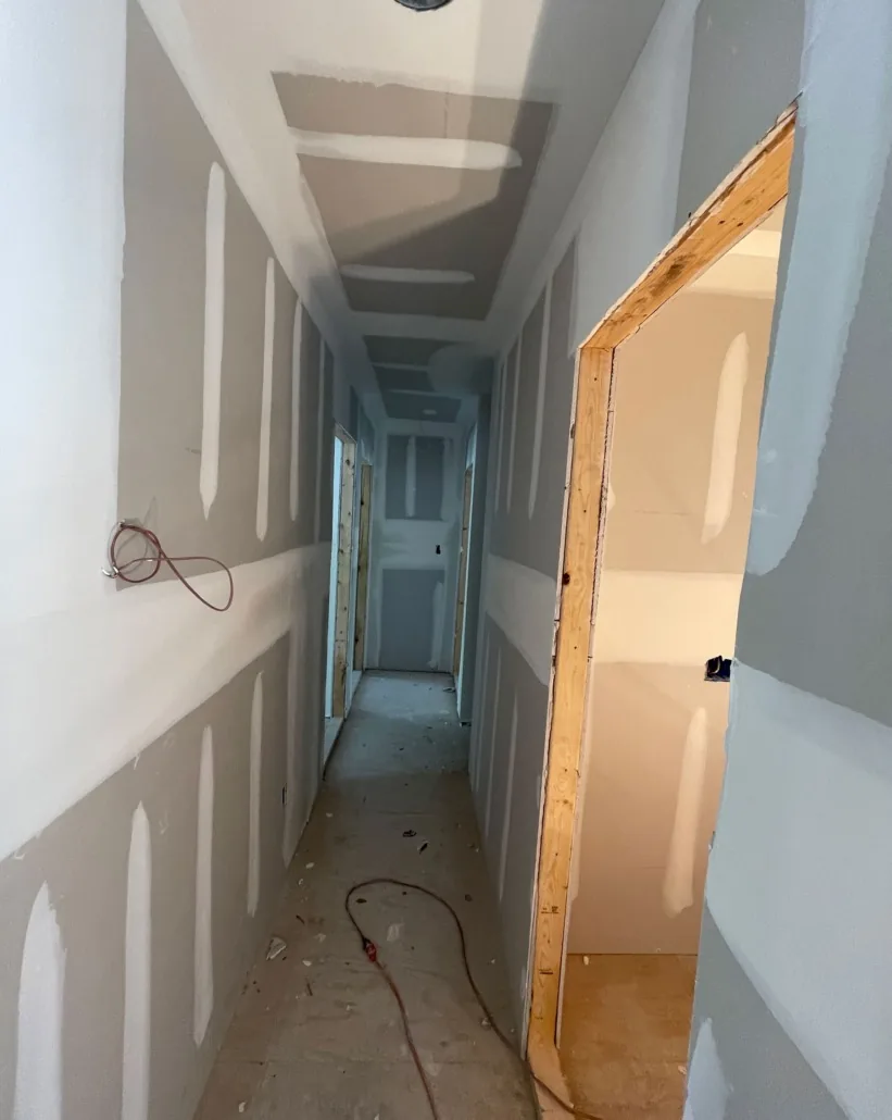 Corridor during drywall repair and finish work