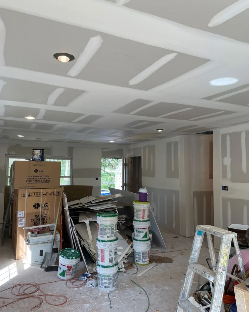 Interior room with taped drywall seams during surface preparation