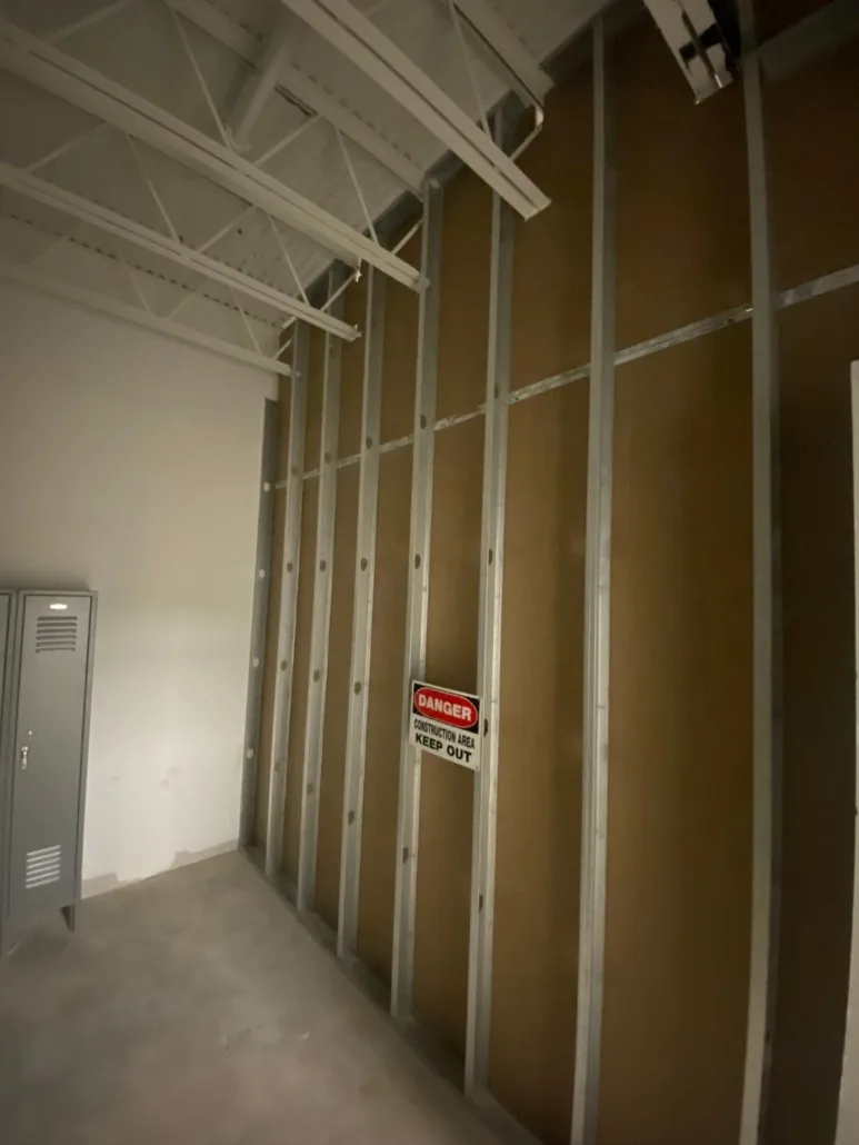 Interior corridor with metal framing and exposed building systems