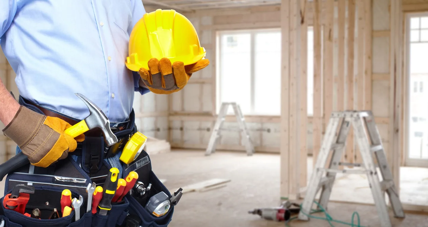 Construction professional reviewing a residential renovation site