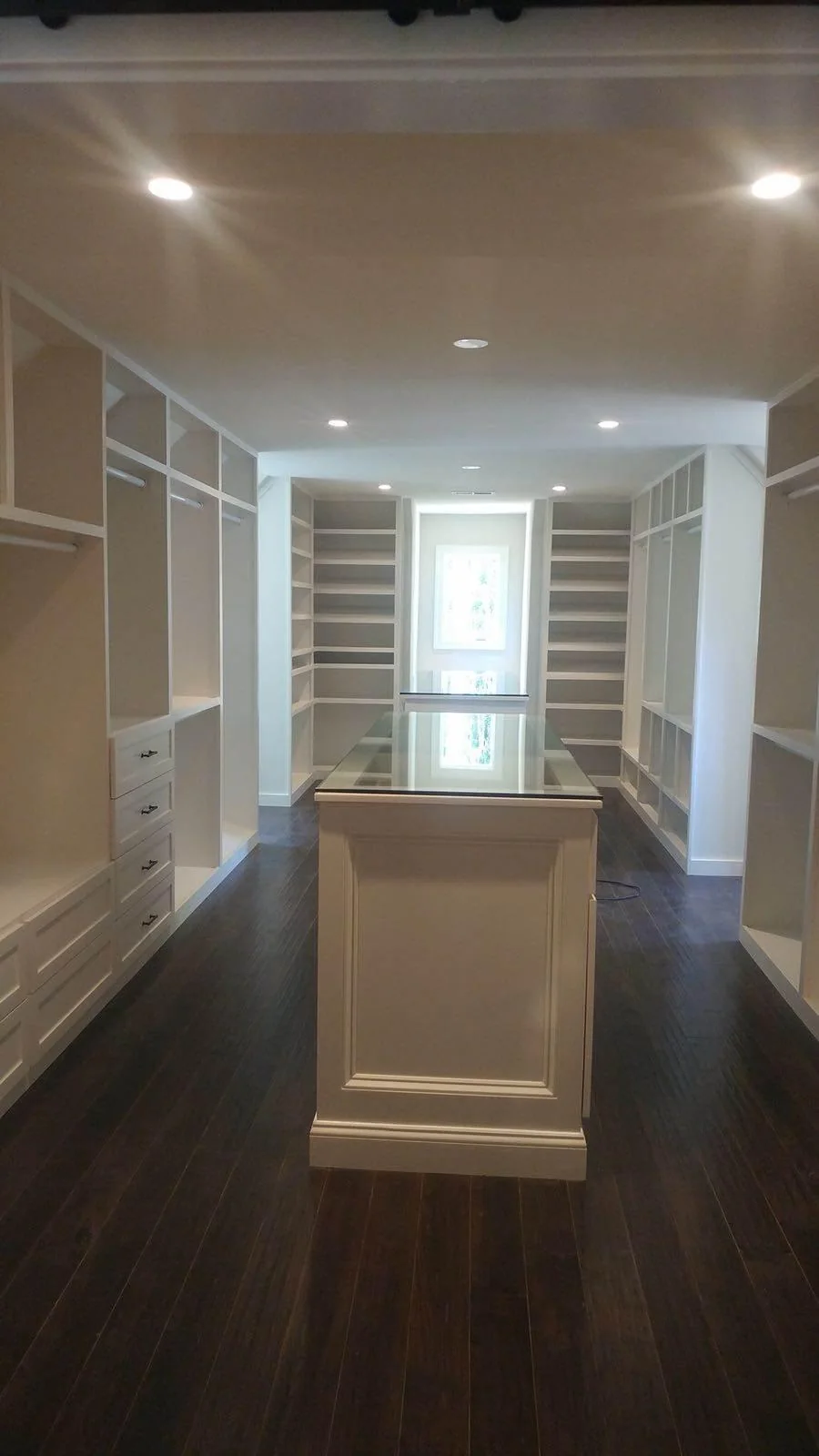 Residential interior hallway with built-in features and updated flooring