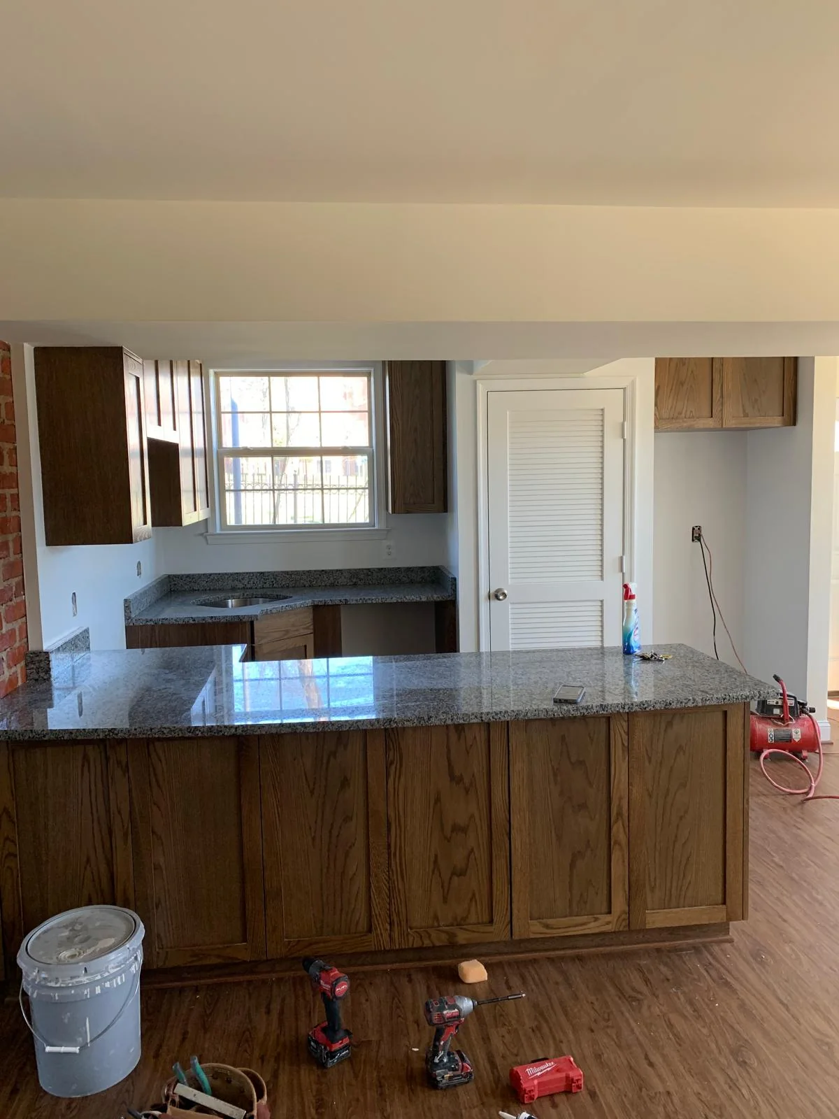 Alternate view of wood kitchen peninsula and surrounding cabinetry